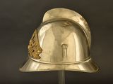 a silver helmet with a gold decoration on it