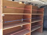 many empty shelves in the back of a moving truck