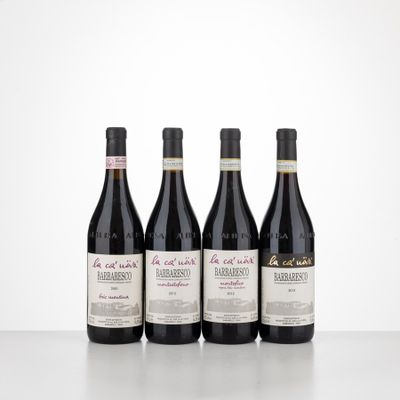 three bottles of wine sit on a table with a white background