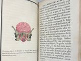 an open book with a drawing of a brain on it