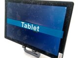 a tablet that is sitting on a stand on the table