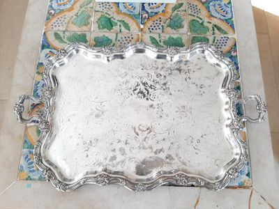 a silver tray sitting on top of a table