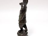 bronze statue of a man with a sword on a pedestal