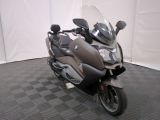 a motorcycle that is parked on a checkered floor
