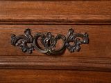a close up of a drawer with a clock on it