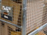 a metal cage with boxes on top of it