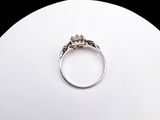 a ring that is sitting on top of a white ball