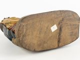 wood sculpture of a shoe with a tag on the side of it