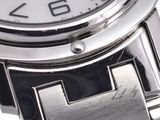 a close up of a wrist watch with a cross on it