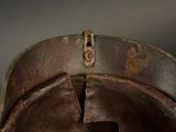 a close up of a helmet with a hole in it