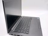 a laptop that is open on a white surface