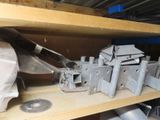 a lot of metal items on a shelf in a room