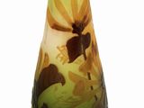 a glass vase with a painting on it on a white surface