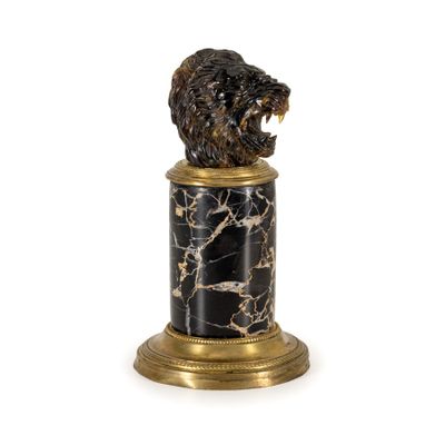 an image of a statue of a bear on a marble pedestal