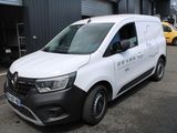 a white van that is parked in front of a building