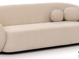 a couch with two pillows on it and a pillow on the back of it