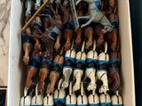 a box full of horse figurines sitting on a table