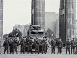 a lot of soldiers standing in front of a military vehicle