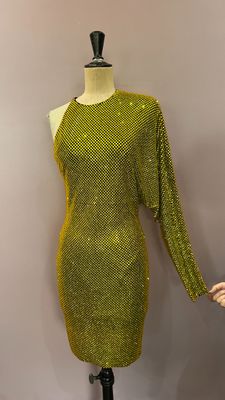 a green dress on a mannequin mannequin stand with a mannequin mannequin
