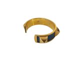 a close up of a gold and blue bracelet on a white background