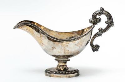 silver plated gravy dish on stand with ornate decoration