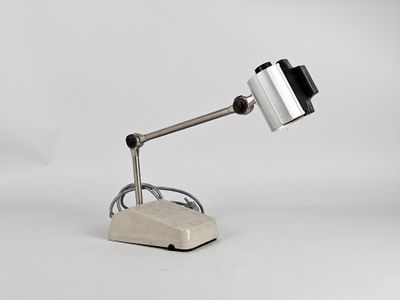 an image of a desk lamp that is on top of a rock