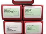 six boxes of soap with labels on them stacked on top of each other