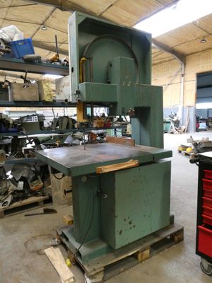 a machine that is sitting in a building with tools
