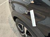 a sticker on the side of a car with a price tag attached to it