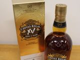 the bottle of chivas regal xx is next to the box