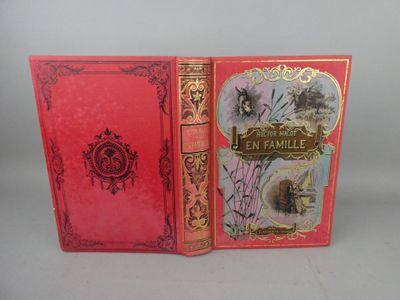 two red books sitting on top of each other on top of a table