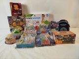 a lot of toys that are sitting on a bed