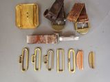 a lot of metal items that are laying out on the table