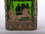a green glass vase with a picture of a man and a woman on a horse drawn carriage