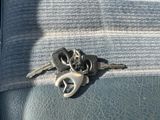a bunch of keys that are on the back of a car