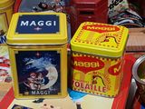 three tins that are sitting on a table
