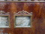 a close up of a metal box with two small windows