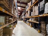 many boxes on the shelves in the warehouse