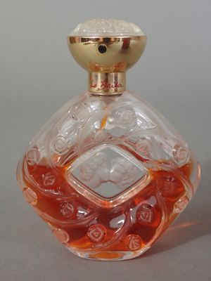 a bottle of perfume sitting on a table