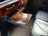 a suitcase sitting on a desk in the back of a car