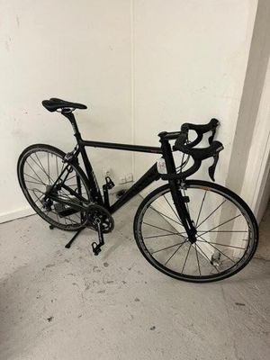 a bike that is leaning up against a wall