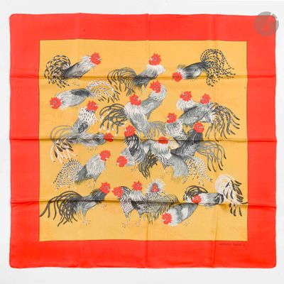 an orange and yellow scarf with roosters and flowers on it