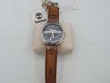 an image of a wrist watch with a brown leather strap