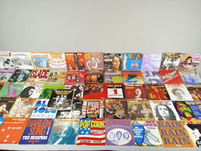 a lot of magazines on a table with a white background