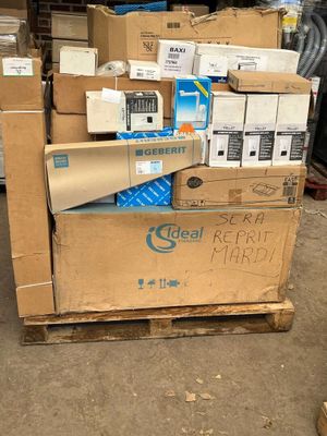 many boxes of electronic equipment on a pallet in a warehouse