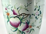 an image of a vase with flowers and fruit painted on it