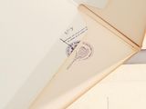 an envelope with a stamp on it sitting on a table