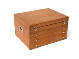 a small wooden box that is on a white surface