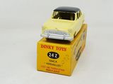 a yellow toy car sitting on top of a yellow box