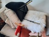 a pile of stuff on a chair in a living room